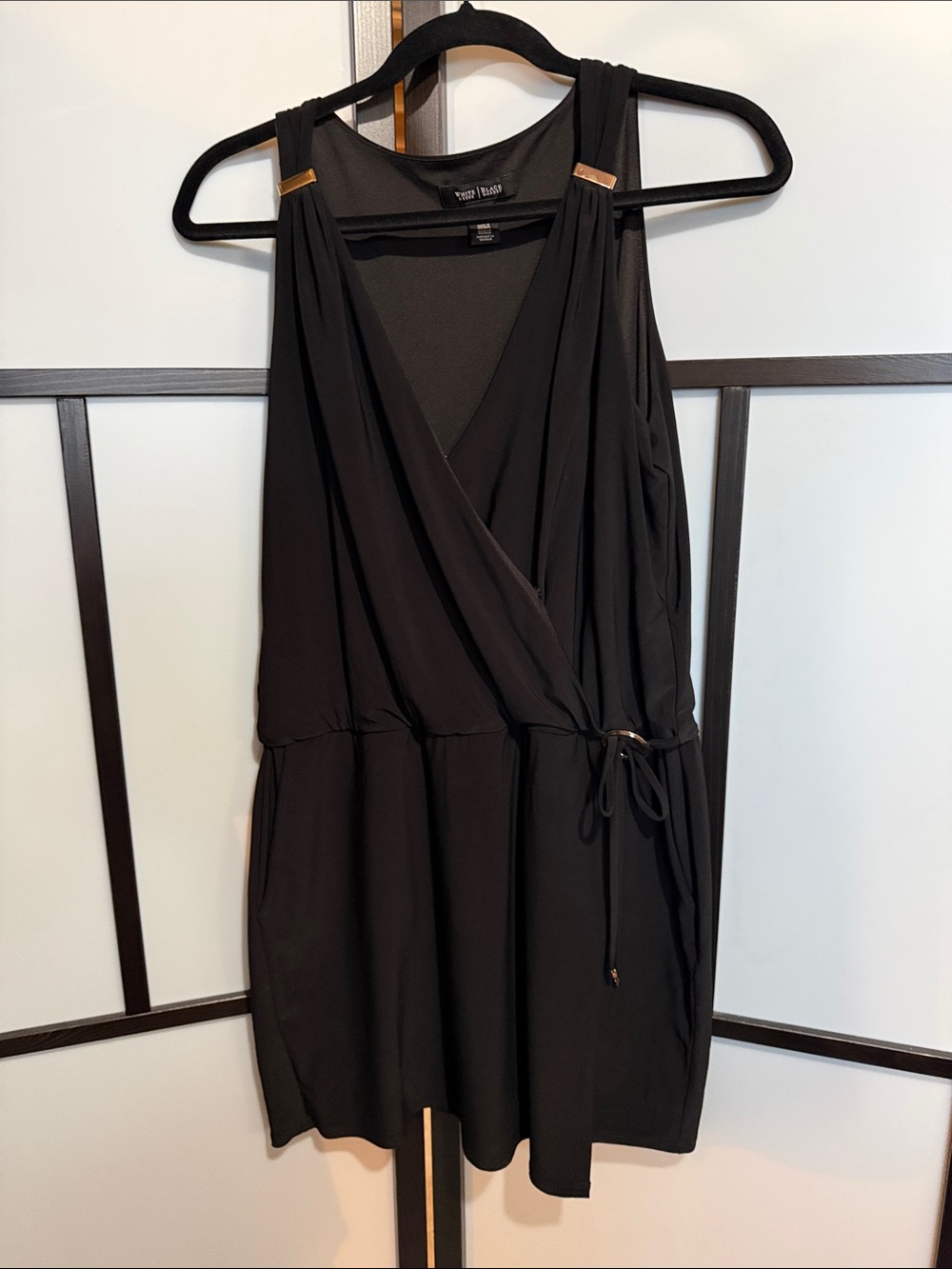 Vince Camuto Black Sleeveless Faux-Wrap Romper with Gold Accents
